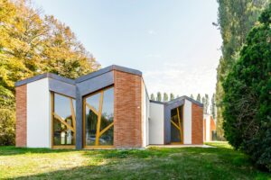 The exterior features angled bricks that reference a local Renaissance building