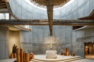 Concrete walls clad the interior of the church